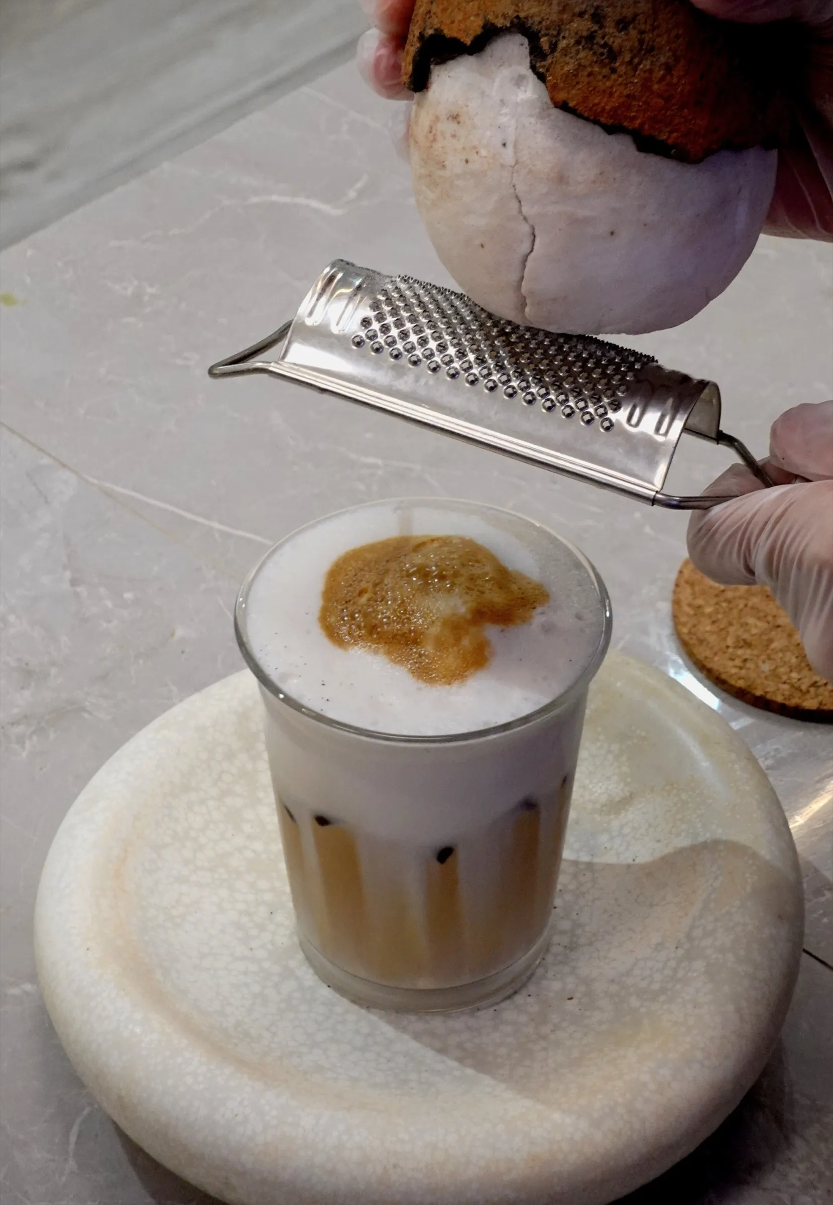 Asin tibuok sea salt being grated over a latte at the Lavande café counter