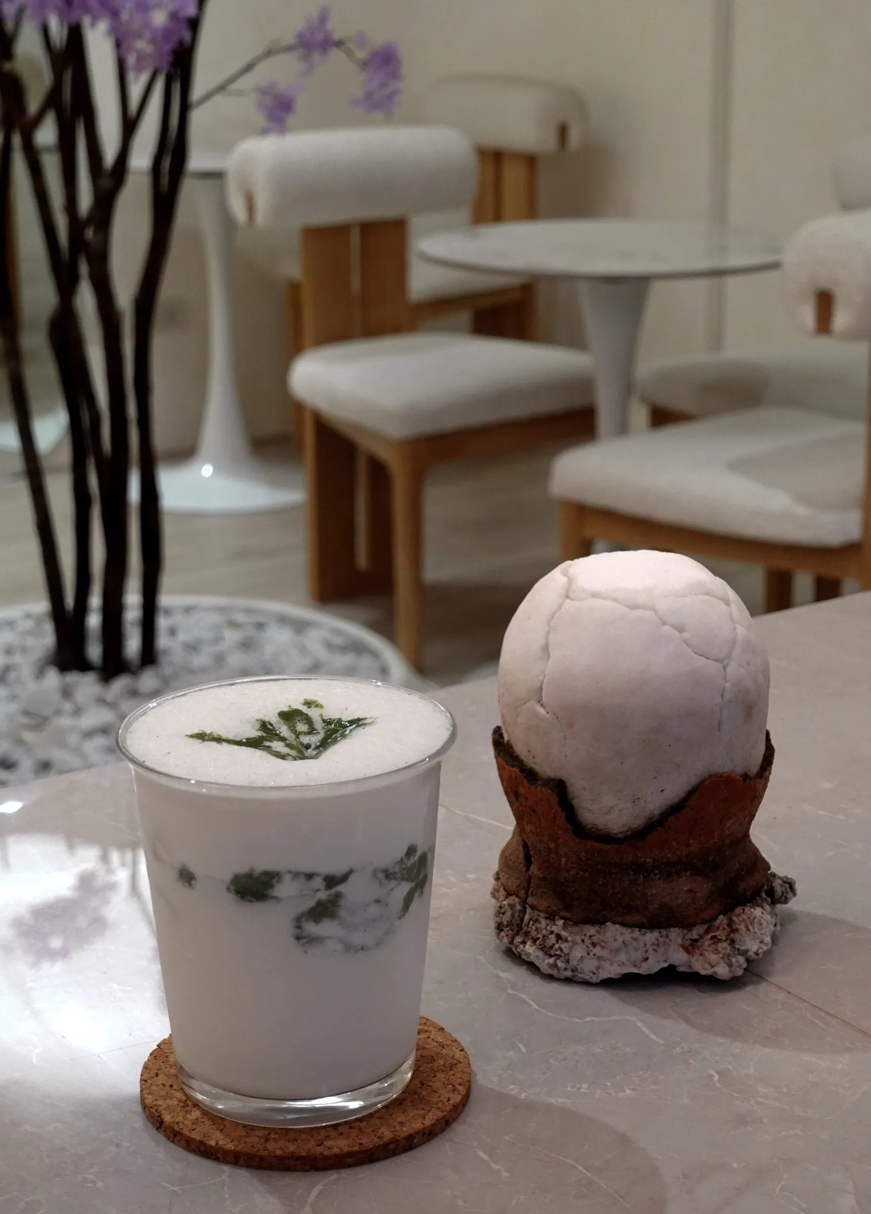 Asin Tibuok Matcha Latte beside a block of asin tibuok sea salt at the Lavande café