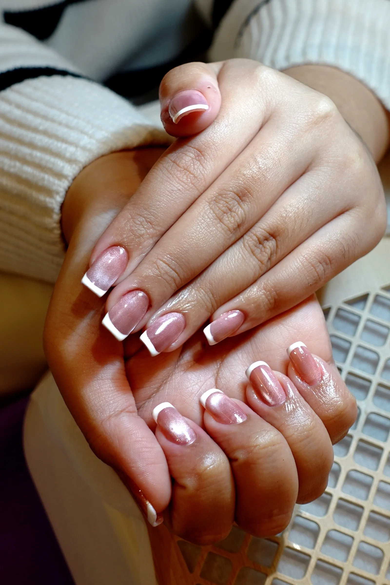 Chrome French tip nail art on almond nails, done at Lavande